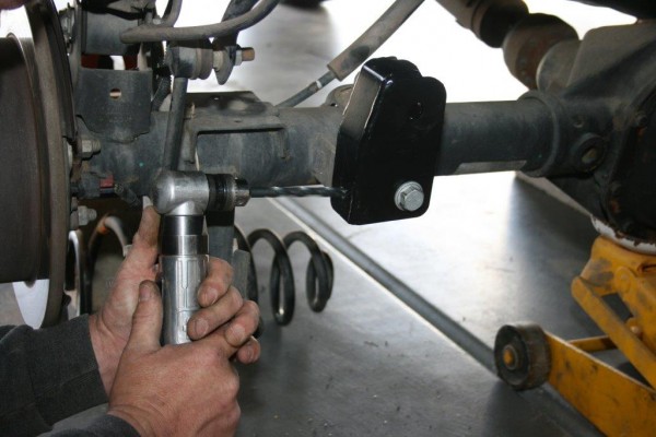 drilling a hole in a suspension mount
