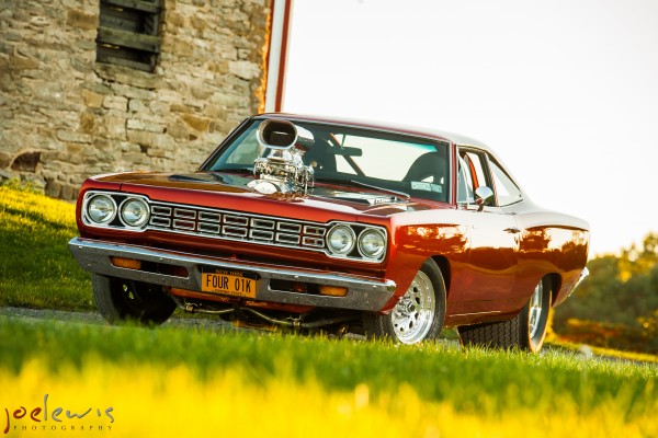 supercharged hemi 1968 Plymouth Roadrunner near old building