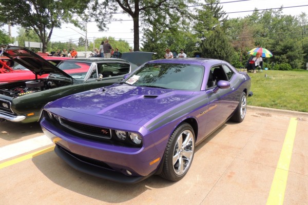 plum crazy late model dodge challenger at car show