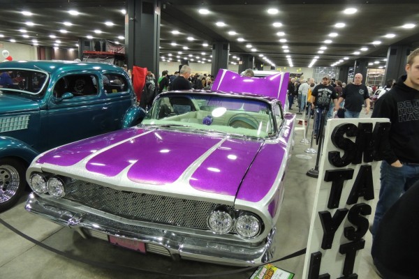 customized purple chevy lowrider coupe from the 1960s
