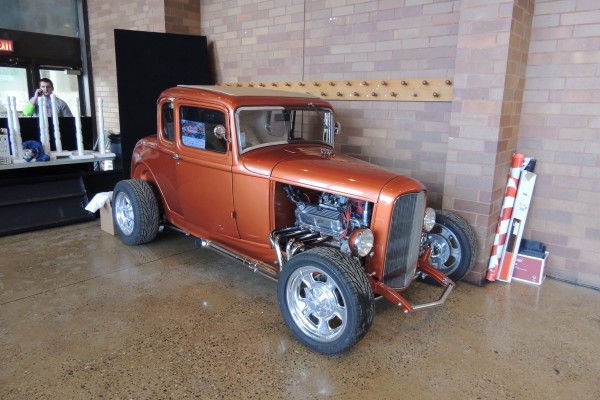 Vintage Ford 5 window coupe hotr rod displayed at indoor car show