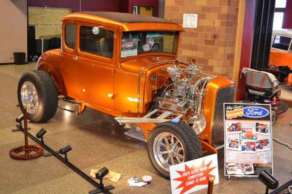 1930 Ford 5 window hot rod coupe displayed at indoor car show
