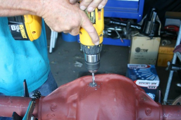drilling a hole for an air line fitting in an axle housing