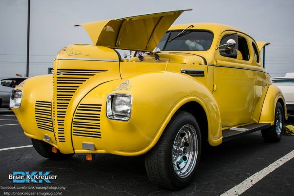 vintage yellow prewar hotrod with square headlights