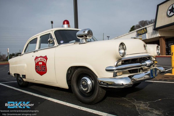 a vintage ford shoebox era vintage Atlanta Police Car from the 1950s