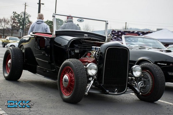 black ford roadster hotrod with a small block chevy v8 engine