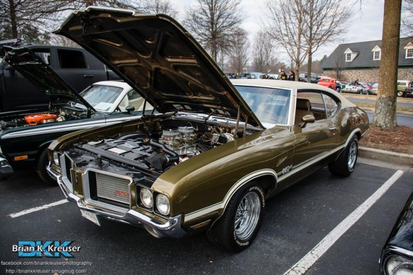 green oldsmobile cutlass 442 at local cruise in car show