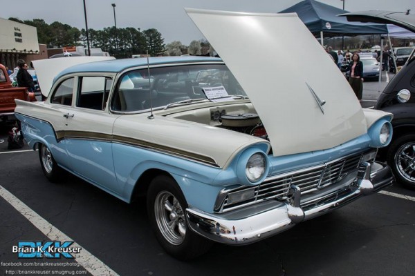 white and blue 1950s era ford fairlane post coupe