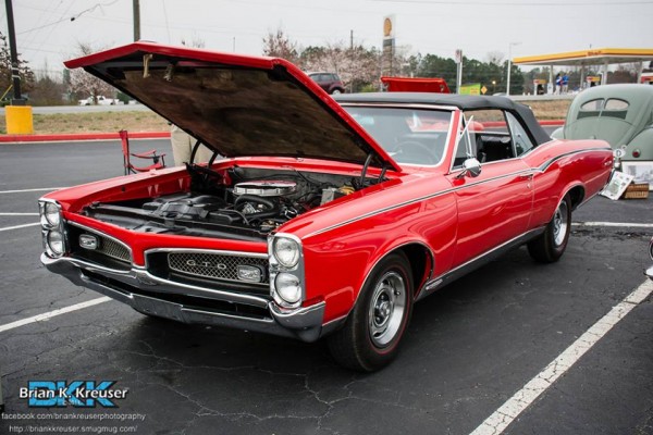 red 1967 pontiac convertible coupe with custom paint stripe