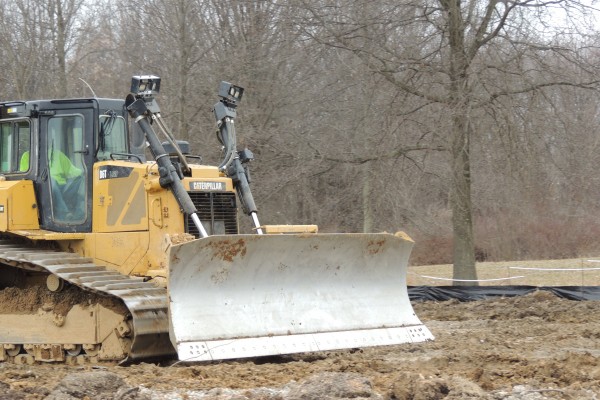 Bulldozer moving dirt at a jobsite