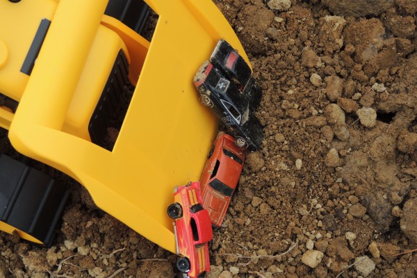Toy Cars Buried in Dirt