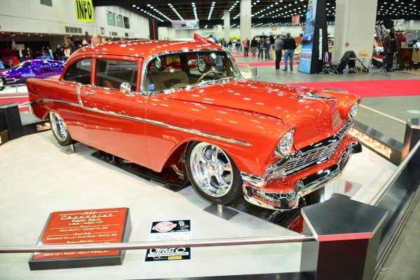 1956 chevy 210 coupe on display at indoor car show