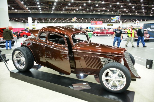 customized ford hot rod on display at indoor car show