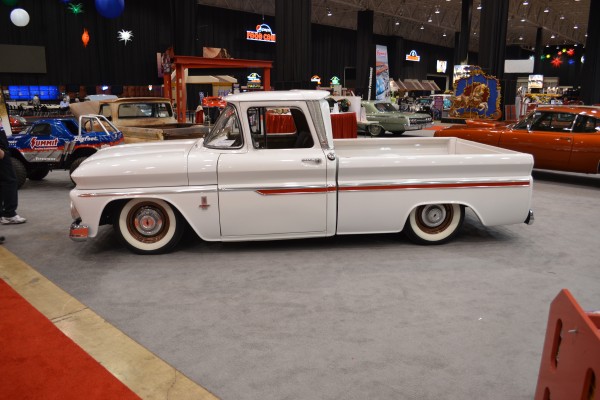white chevy c10 truck on display at car show