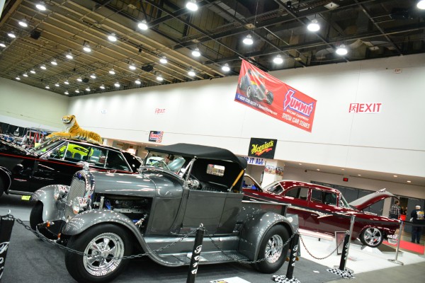 hot rods and muscle cars on display at indoor car show