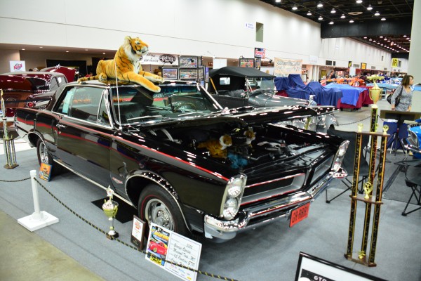 1965 pontiac gto coupe on display at indoor car show