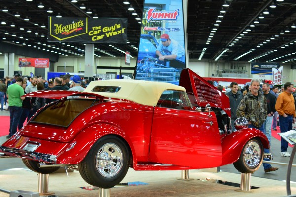 hot rod coupe on display at indoor car show