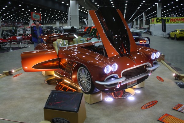 customized c1 corvette on display at indoor car show