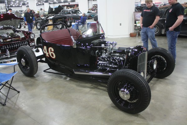 speedster style ford hot rod on display at indoor car show