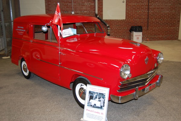 vintage red crosley wagon on display at indoor car show