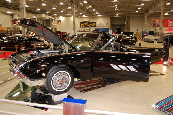 custom ford thunderbird coupe on display at indoor car show