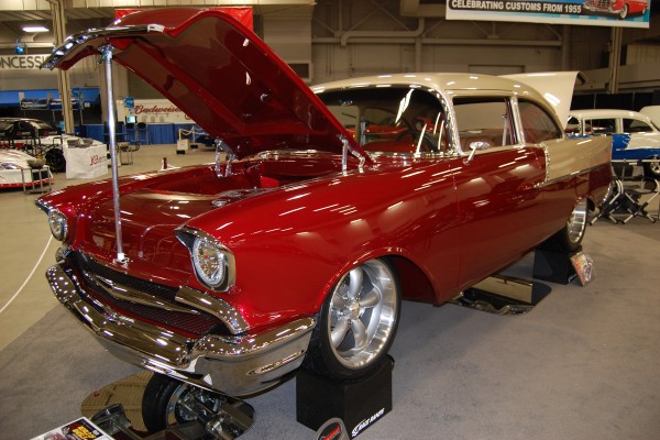 custom tri five chevy show car on display at indoor car show
