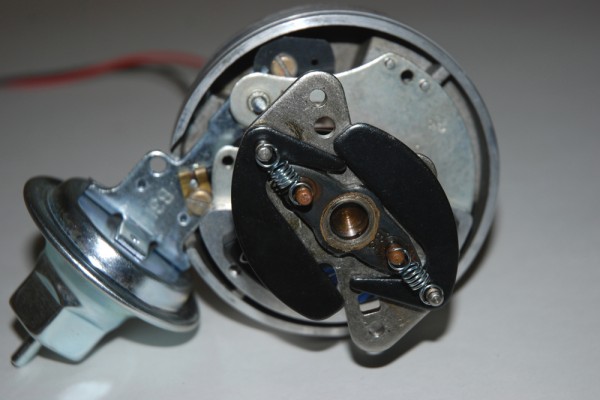 close up a mechanical advance mechanism on an automotive engine distributor