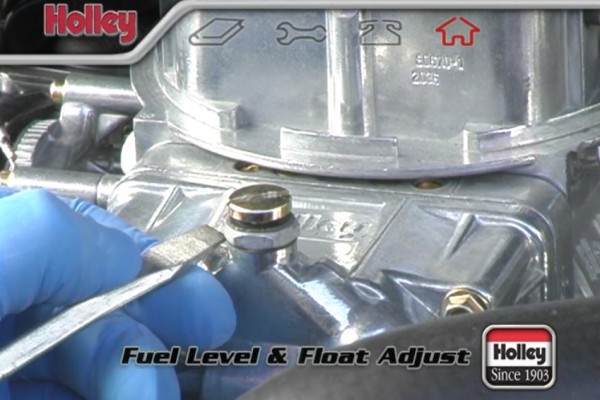 loosening float level screw on a holley carburetor