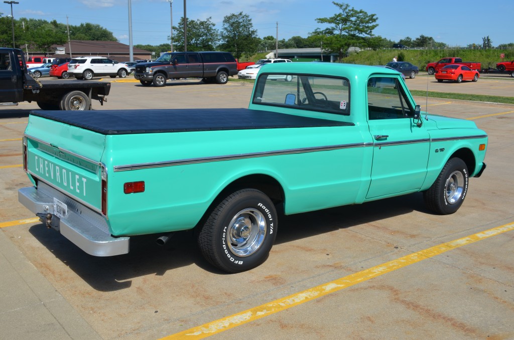 aqua green 1969 chevy c10 pickup truck, rear passenger side