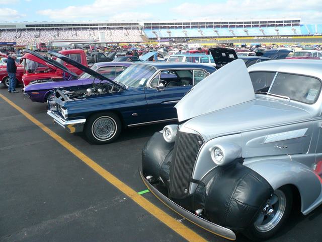 rows of classic cars at a large car show