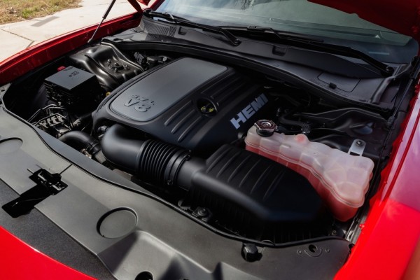 hemi engine in a red 2015 dodge charger sedan