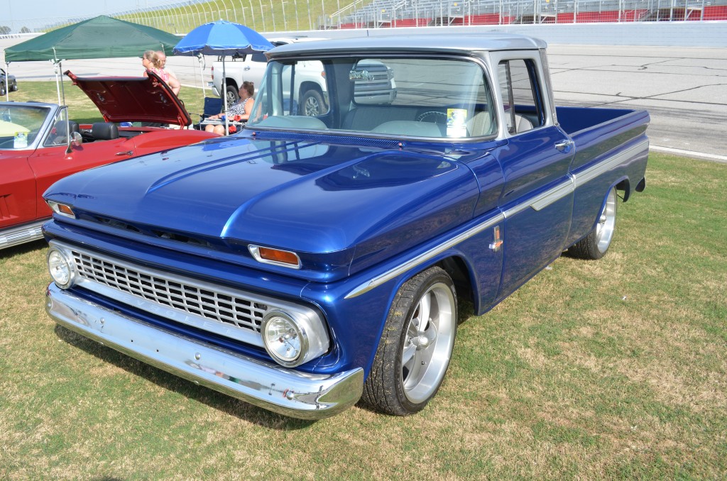 vintage chevy pickup truck with custom wheels and paint