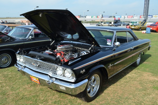 vintage ford fairlane thunderbolt with its hood open