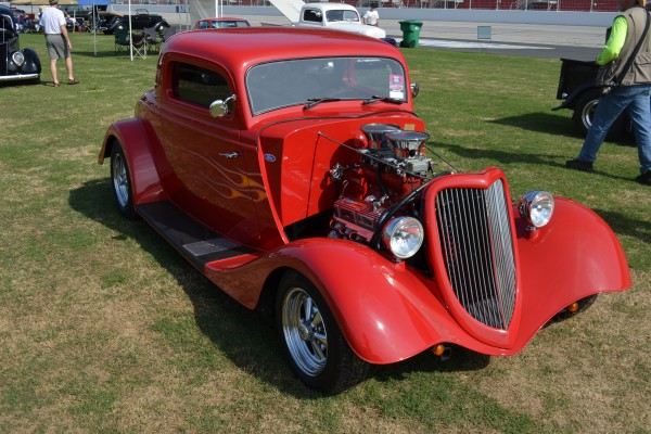 a vintage red eliminator style ford hot rod coupe