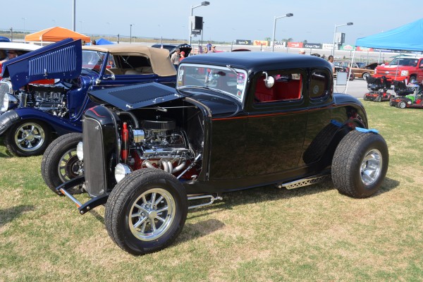 vintage black ford five window hot rod coupe
