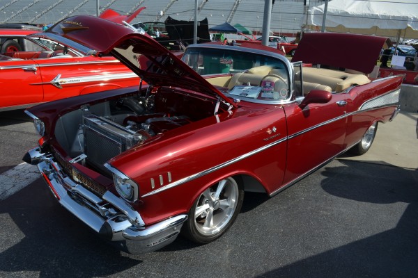 a 1957 chevy bel air convertible with custom wheels