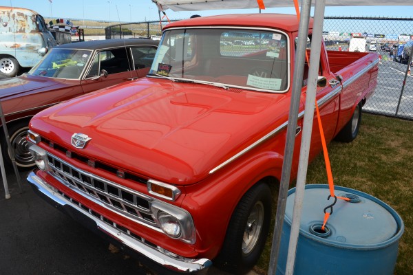 vintage ford f-100 truck at a car show