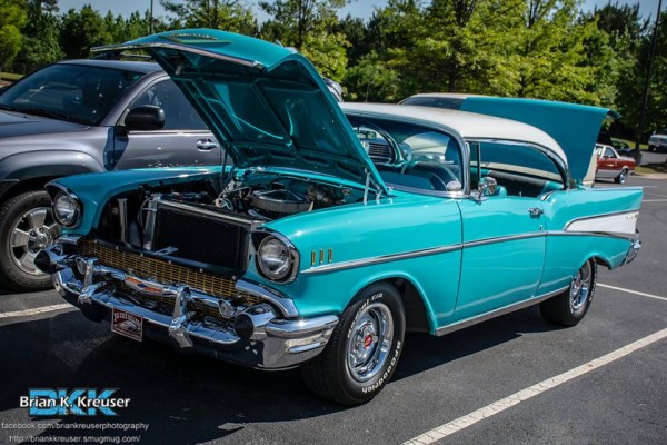 blue 1957 chevy bel air coupe with its hood up