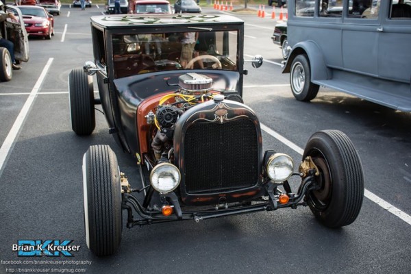 vintage hot rod with a pinstriped grille