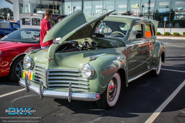 vintage pre war luxury sedan at a classic car show