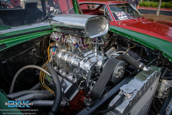 supercharged engine in an old hot rod muscle car