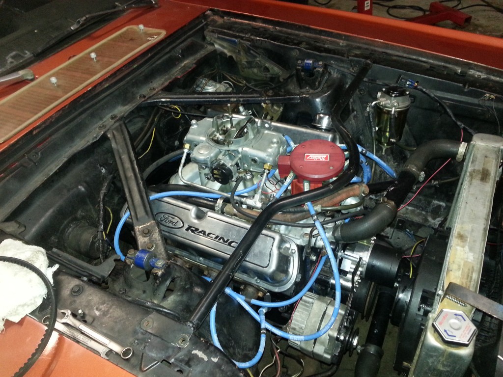 393 stroker motor in a 1966 ford mustang engine bay