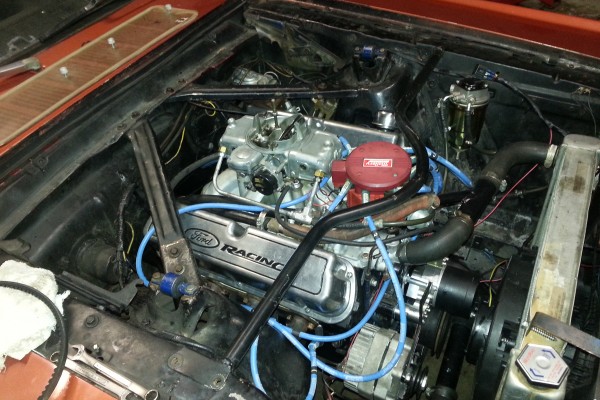393 stroker motor in a 1966 ford mustang engine bay