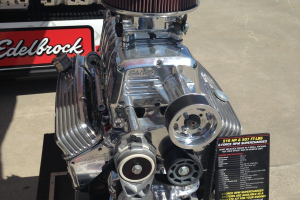 edelbrock e force supercharger engine displayed at a trade show