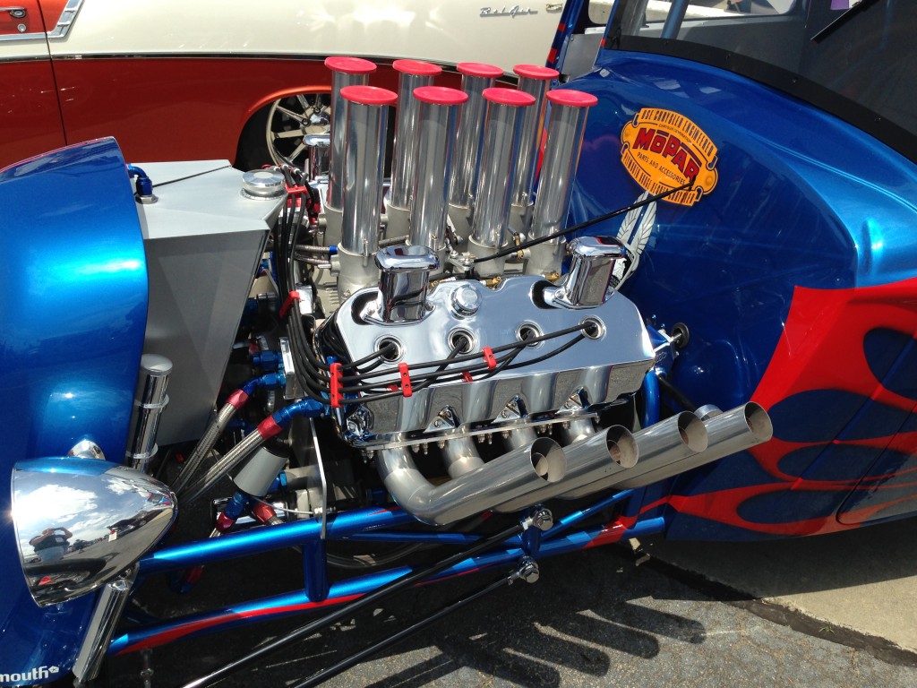 custom hemi mopar v8 engine in a hot rod with zoomie pipes