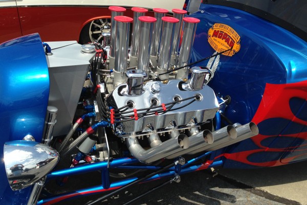 custom hemi mopar v8 engine in a hot rod with zoomie pipes