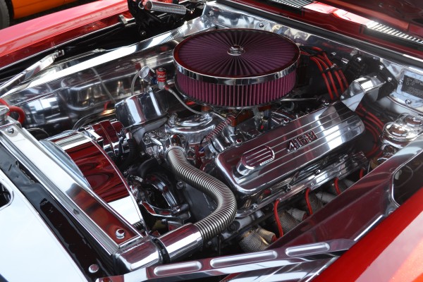 chromed out custom engine bay of a vintage classic car