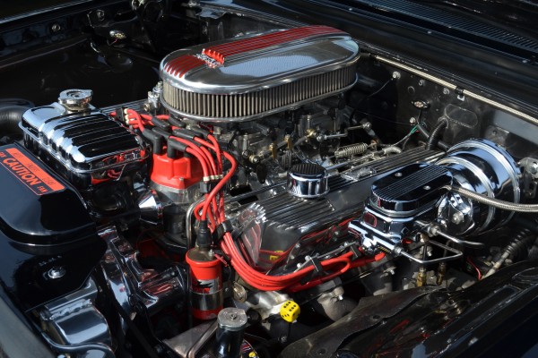 v8 engine with dual quad carburetors in a classic muscle car