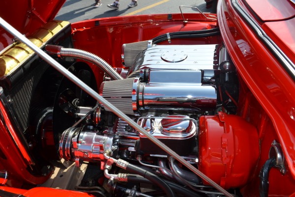 customized v8 engine with fabricated intake in an old hot rod