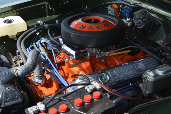 mopar magnum v8 engine in an old muscle car